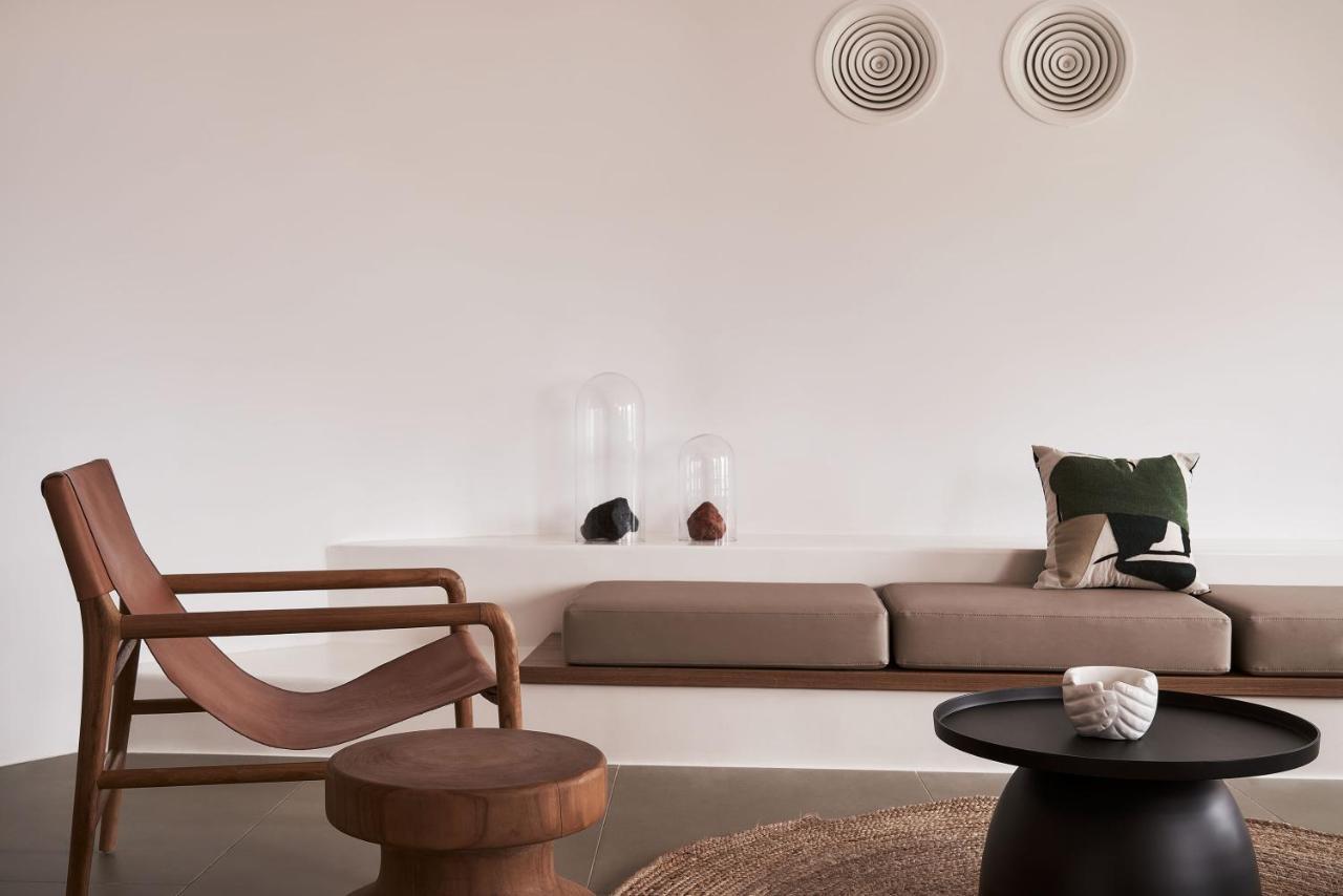 Orama Hotel & Spa Fira  Exterior foto A living room with a sofa and a chair